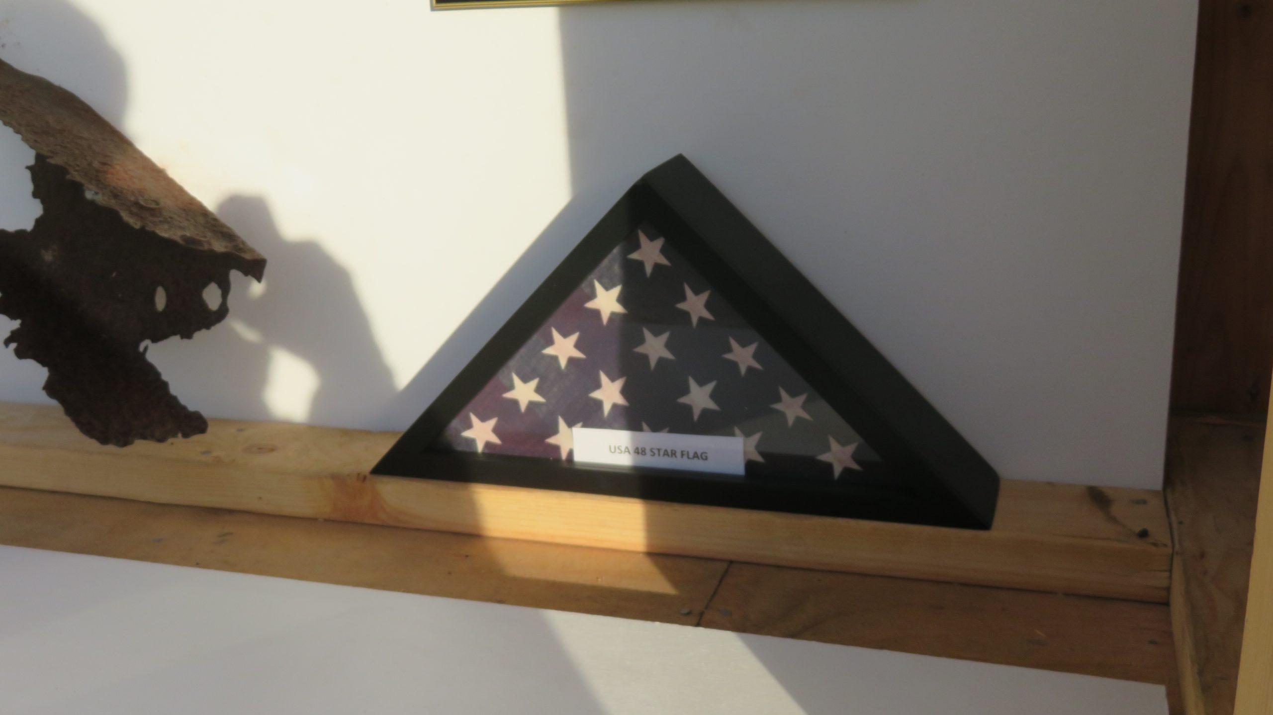 photo of flag from USS Arizona Remnant display